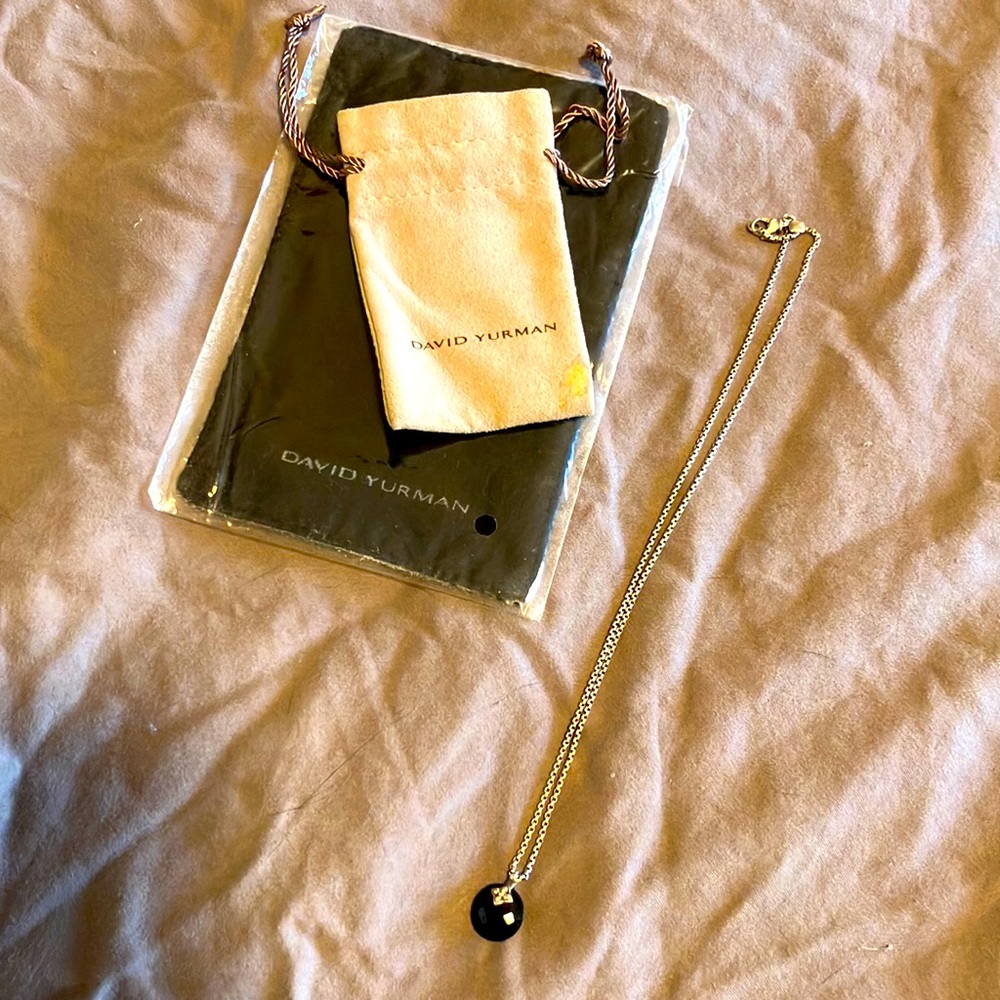 David Yurman sterling silver with black onyx and diamond pendant.